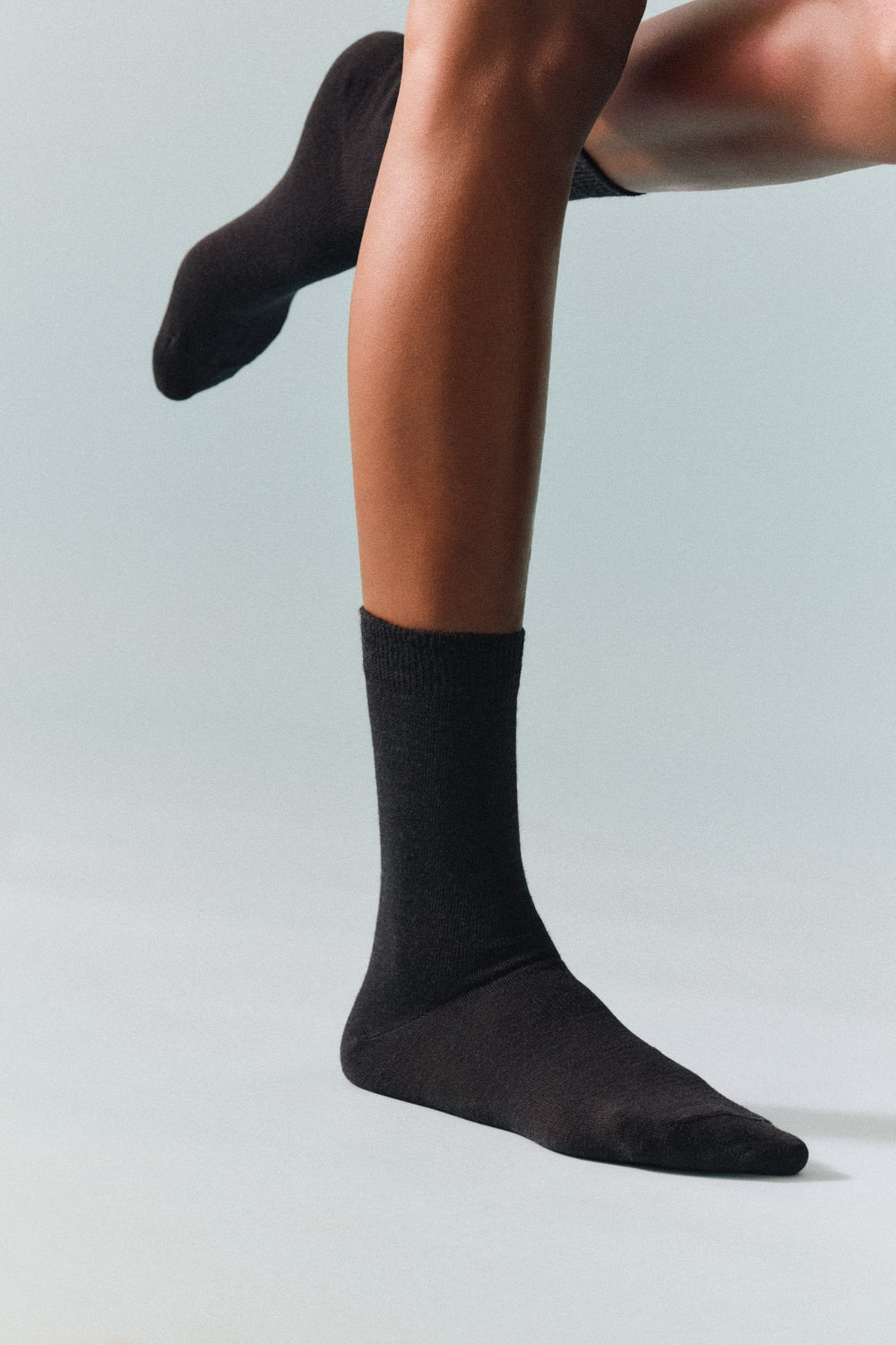 Model wearing merino wool socks