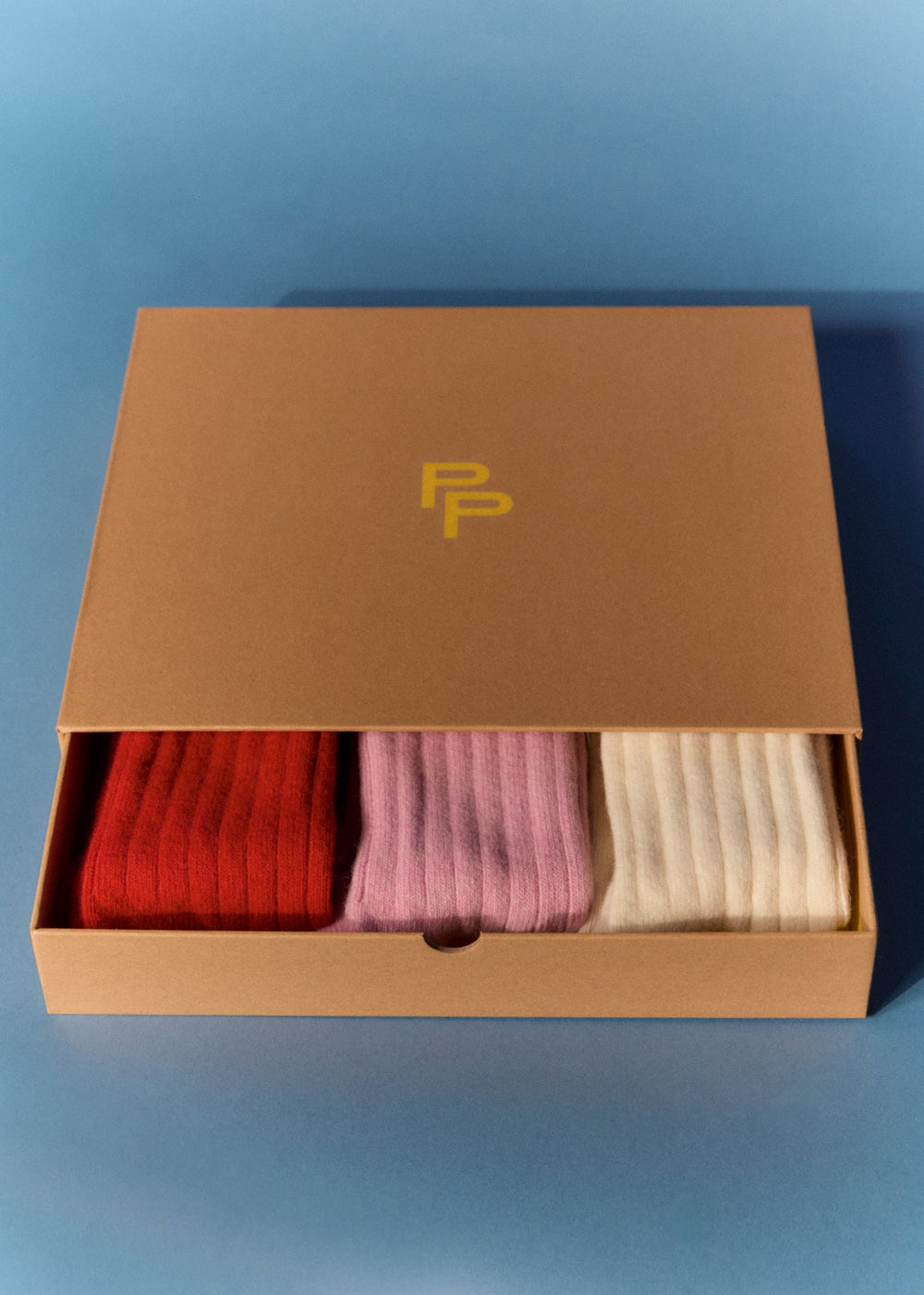 Merino Wool Bed Socks Gift Set Two - three pairs of merino wool bed socks in a brown box which PP yellow branding on the top