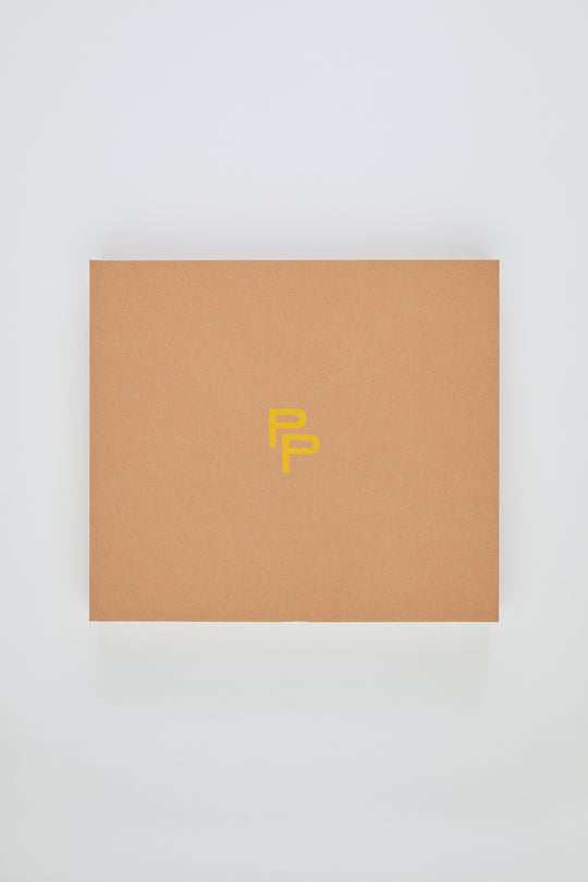 Brown box with a yellow logo on a white background