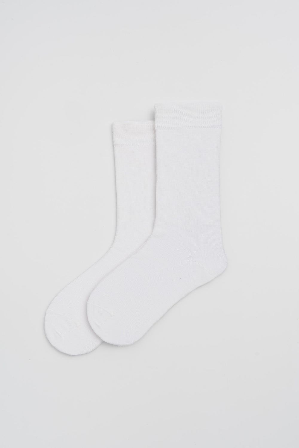 White merino socks on a light grey background