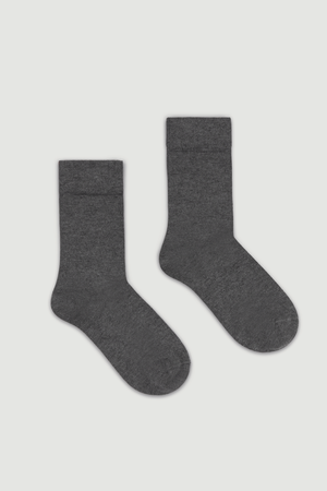 Pair of grey bamboo calf length socks on a white background
