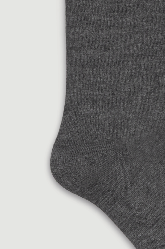 Close-up of the heel of a grey bamboo calf length sock on a white background