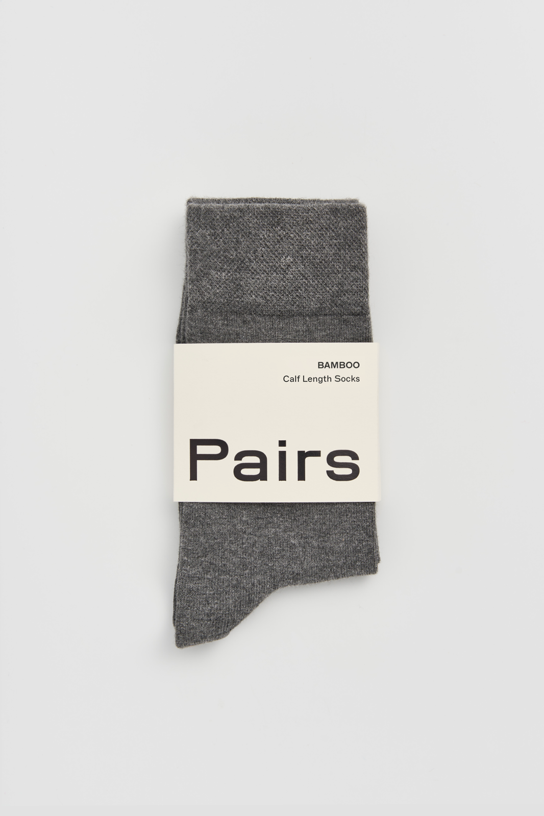 Gray calf-length bamboo sock with a 'Pairs' packaging band on a light grey background