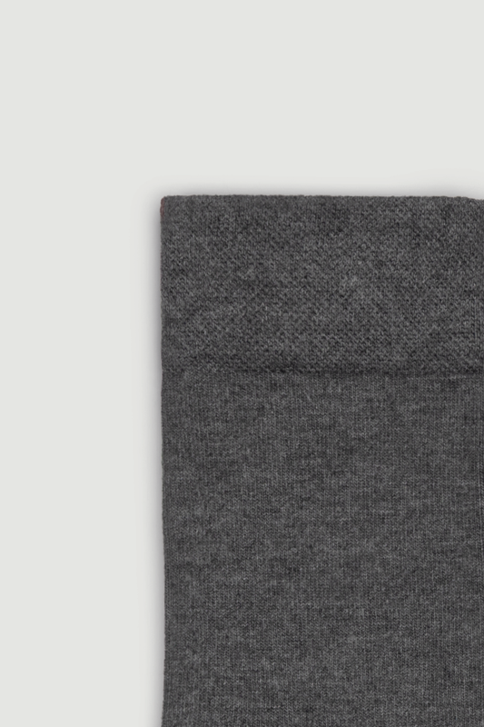 Close-up of the top of a grey bamboo calf length sock on a white background