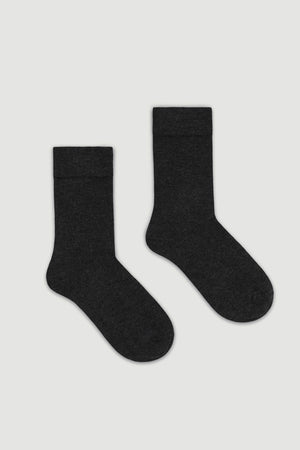 Pair of dark grey bamboo calf length socks on a white background