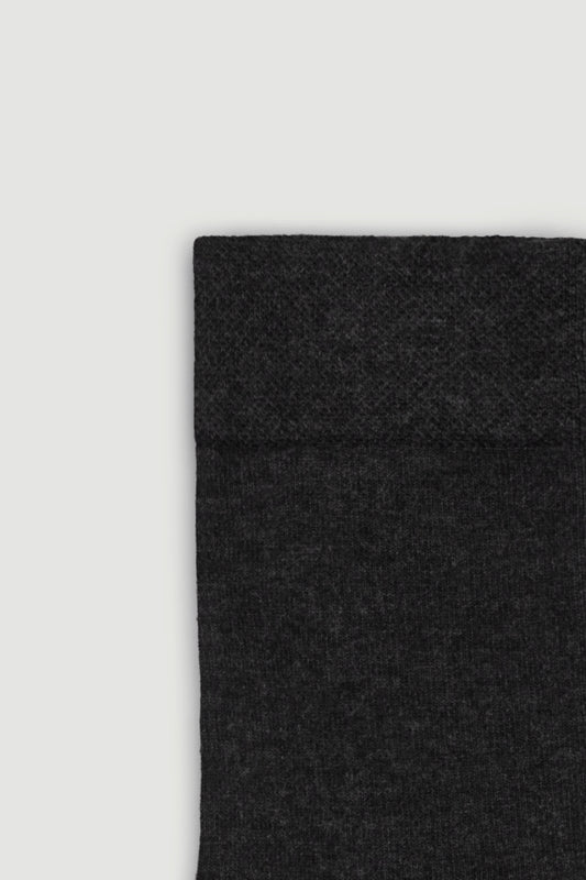 Close-up of the top of a dark grey bamboo calf length sock on a white background