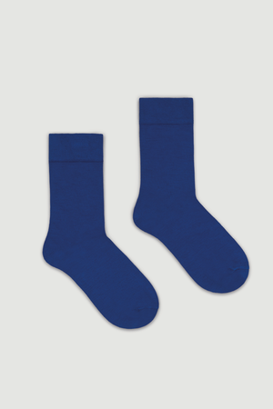 Pair of blue bamboo calf length socks on a white background
