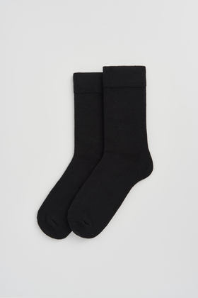 Pair of black calf-length bamboo socks  on a light grey background