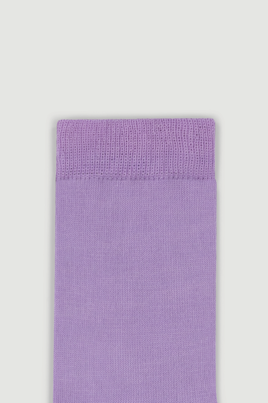 Close-up of the top of a lilac calf length merino sock on a white background