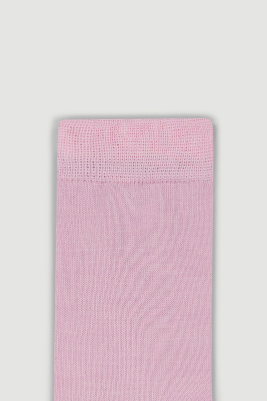 Close-up of the top of a light pink calf length merino sock on a white background