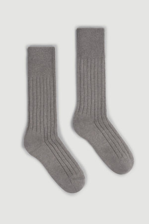 Pair of grey merino ribbed bed socks on a white background