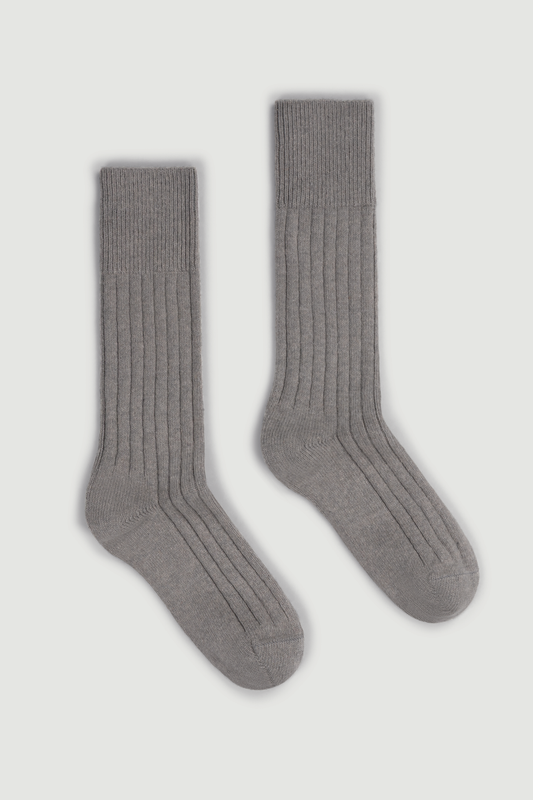Pair of grey merino ribbed bed socks on a white background
