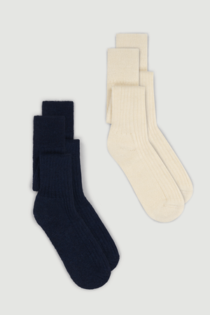 Pair of navy and cream wool knee high socks on a white background
