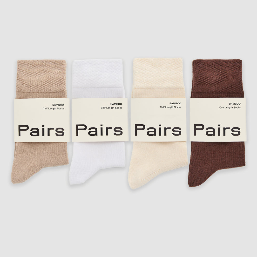 Four pairs of bamboo socks in beige, white, and brown with 'Pairs' labels on a light gray background.