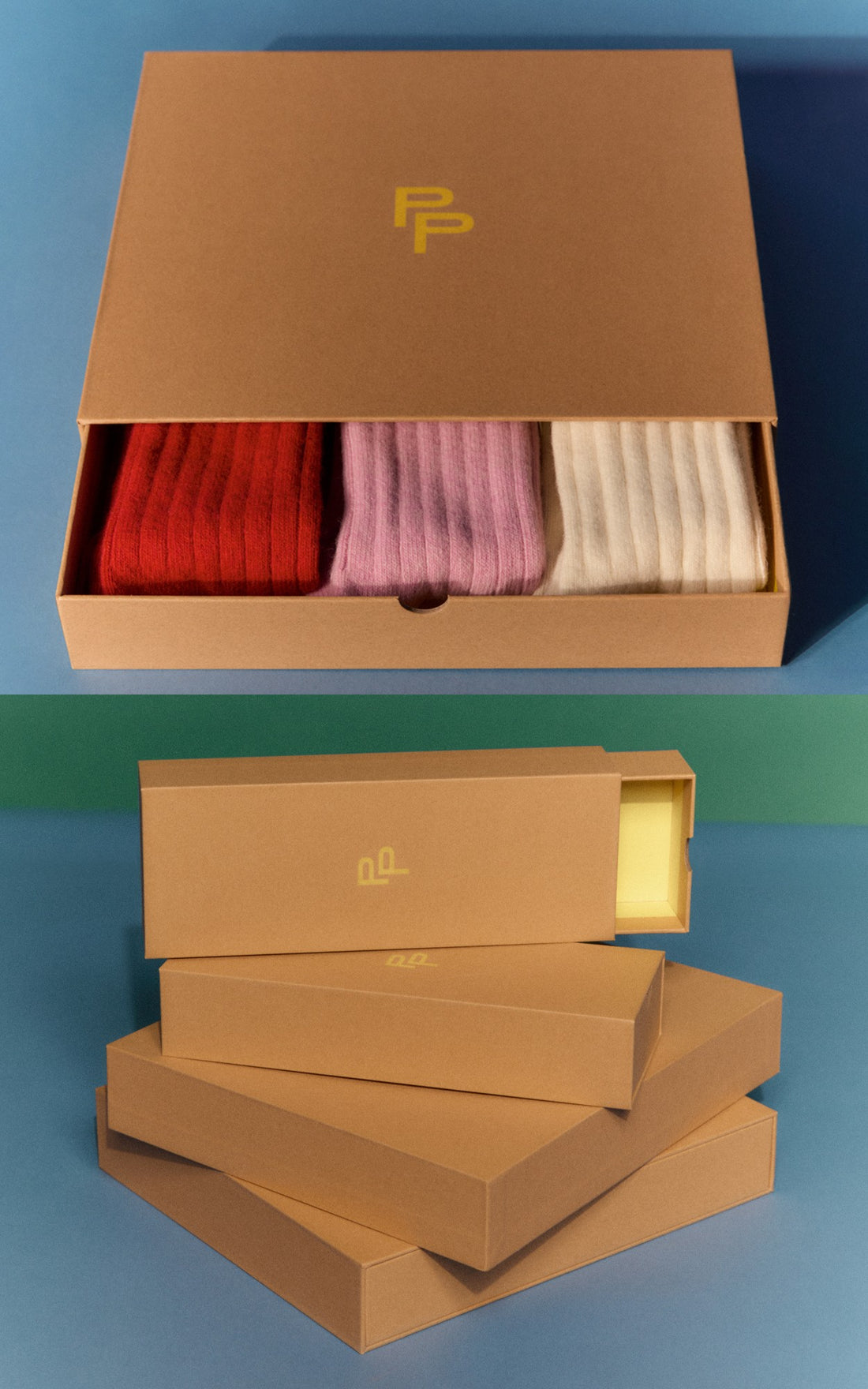 Brown sock packaging box with red, pink, and beige socks inside on a blue background.